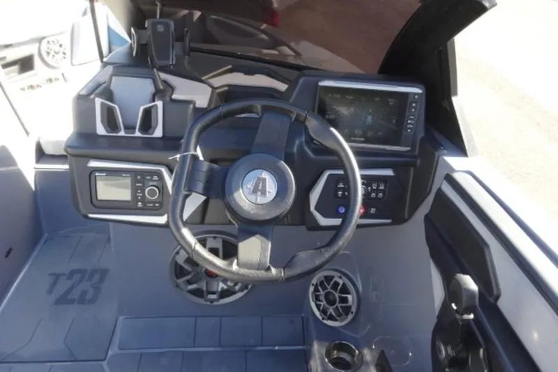 Slide: The Image of 2022 Axis T23 boat dashboard with steering wheel and control panel. - 3