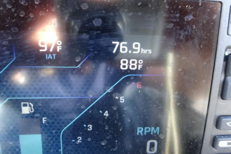 Slide: The Image of Dashboard display of a 2022 Axis T23 showing temperature, hours, and fuel level. - 7
