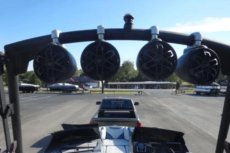 Slide: The Image of 2022 Axis T23 boat with tower speakers in a parking lot. - 9