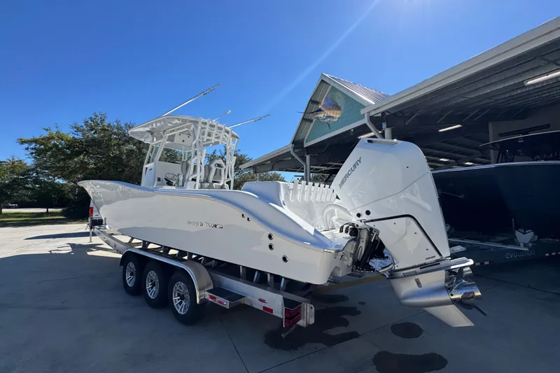 Slide: The Image of 2026 Cape Horn 34 XS boat with Mercury engine on trailer, parked outdoors. - 13