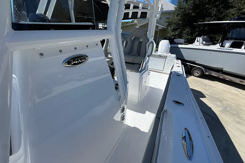 Slide: The Image of 2026 Cape Horn 34 XS boat interior with seating and console, showcasing sleek design. - 21