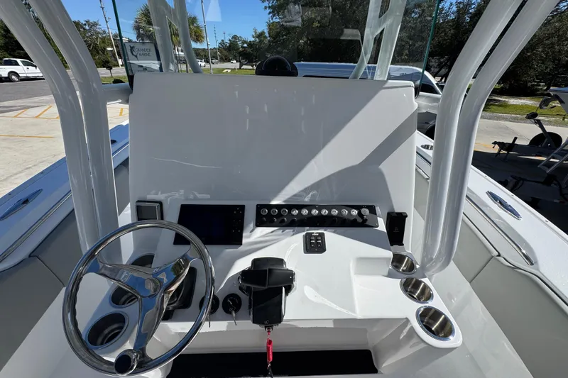 Slide: The Image of 2026 Cape Horn 34 XS boat dashboard with steering wheel and control panel. - 27