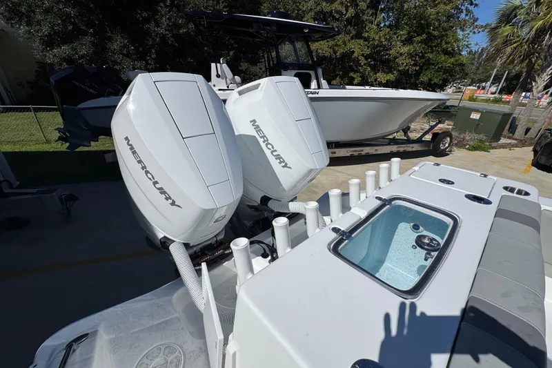 Slide: The Image of 2026 Cape Horn 34 XS boat with dual Mercury engines and fishing rod holders. - 38