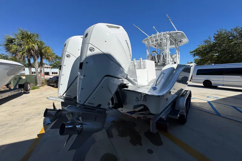 Slide: The Image of 2026 Cape Horn 34 XS boat with dual outboard engines on a trailer. - 10