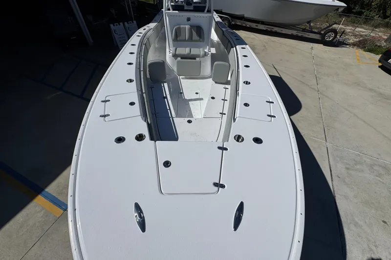 Slide: The Image of 2026 Cape Horn 34 XS boat, spacious deck view, white finish, docked outdoors. - 18