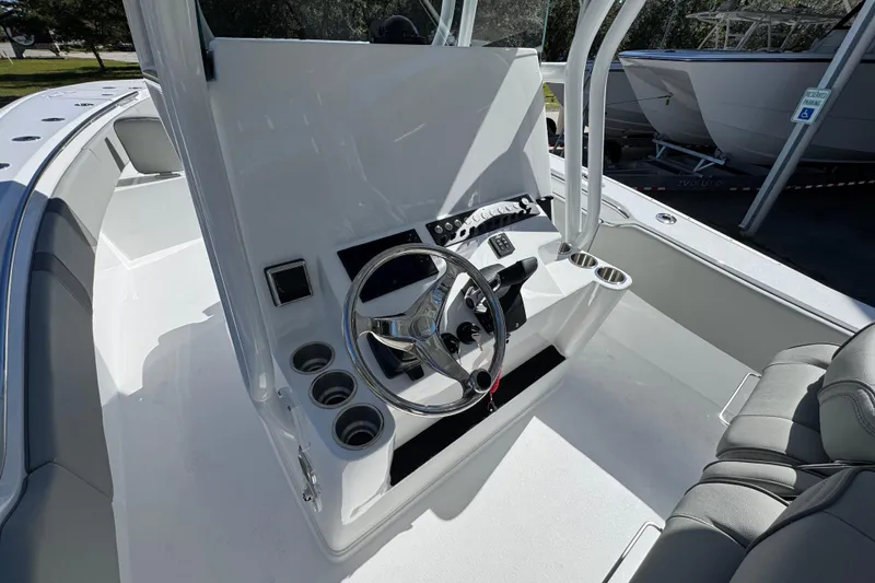 Slide: The Image of 2026 Cape Horn 34 XS boat cockpit with steering wheel and seating. - 26