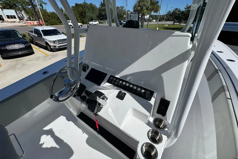 Slide: The Image of 2026 Cape Horn 34 XS boat console with steering wheel and control panel. - 29