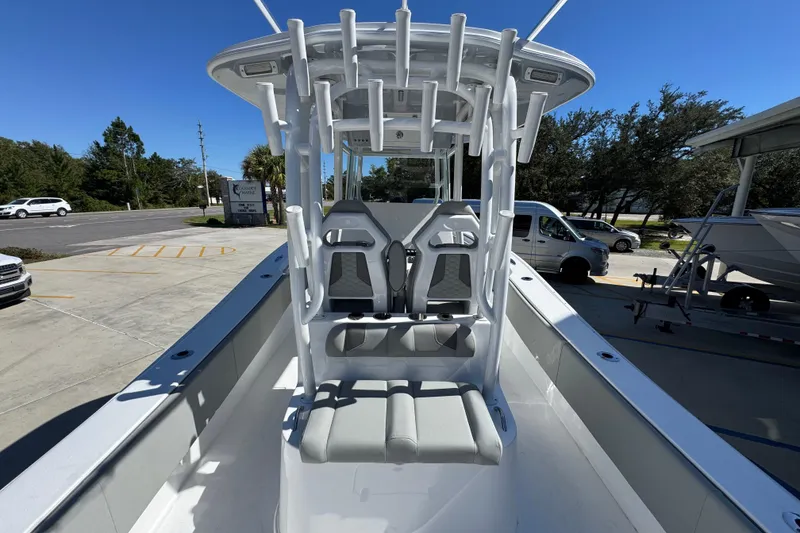 Slide: The Image of 2026 Cape Horn 34 XS boat with sleek seating and modern design in a sunny outdoor setting. - 32