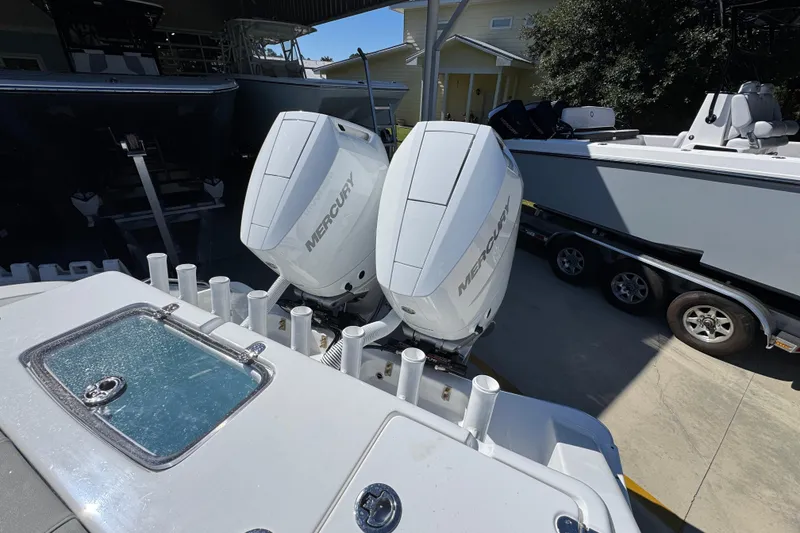 Slide: The Image of 2026 Cape Horn 34 XS boat with dual Mercury outboard engines, parked on a trailer. - 37