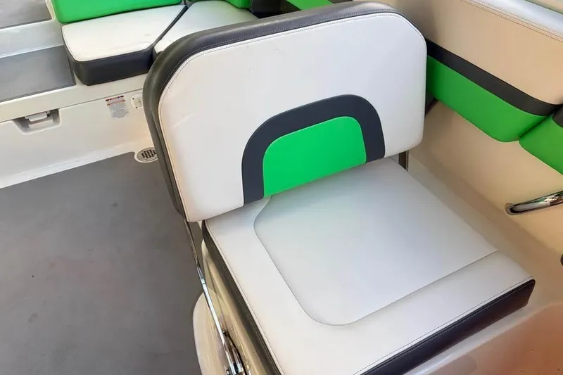 Slide: The Image of 2017 Chaparral Vortex 243 VRX boat seat with green and white upholstery. - 11