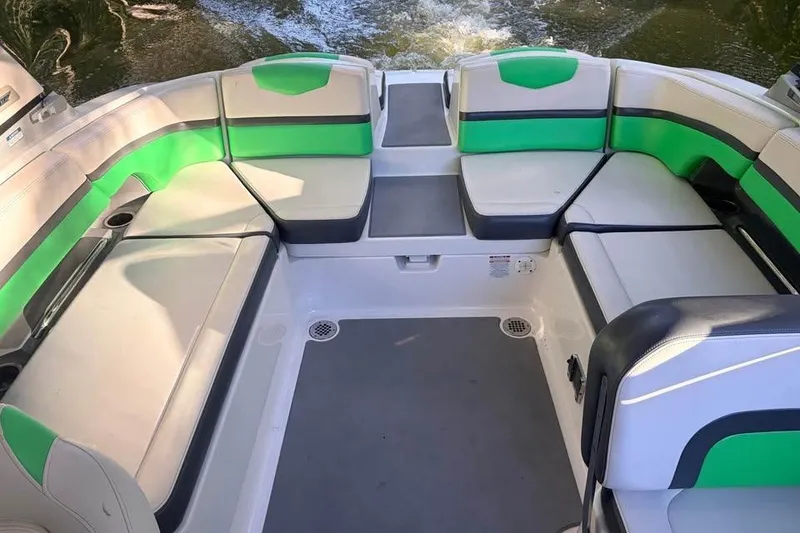 Slide: The Image of 2017 Chaparral Vortex 243 VRX boat interior with green and white seating. - 13