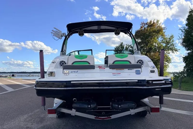 Slide: The Image of 2017 Chaparral Vortex 243 VRX boat on trailer, rear view, clear sky background. - 2