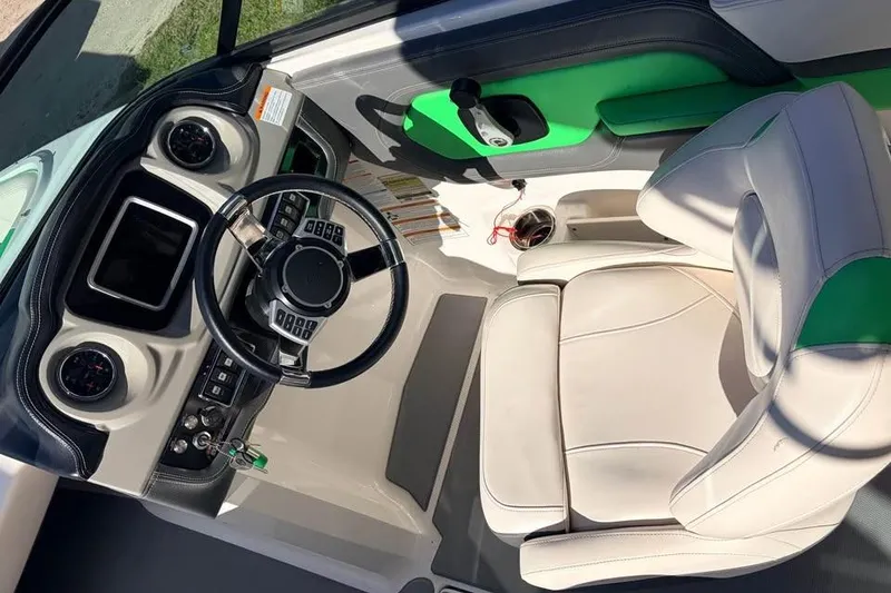 Slide: The Image of 2017 Chaparral Vortex 243 VRX boat interior with steering wheel and dashboard. - 9