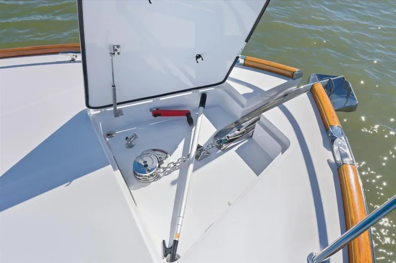 Slide: The Image of Hinckley Talaria 43 (2015) anchor locker with chain and tools on deck. - 16