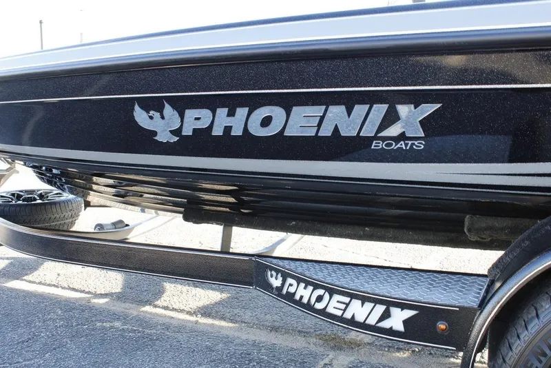 Slide: The Image of 2025 Phoenix 921 ELITE boat with logo on trailer, black finish. - 11