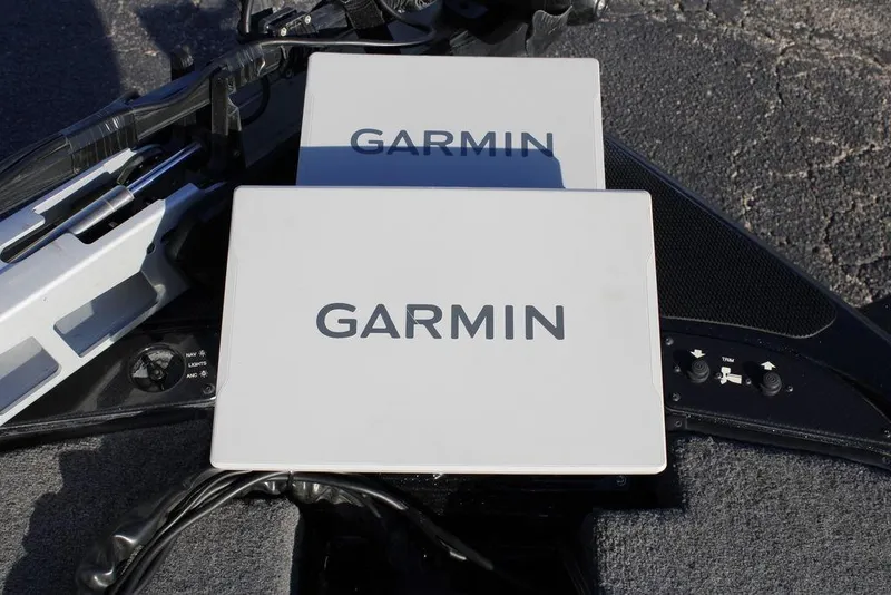 Slide: The Image of Garmin devices on 2025 Phoenix 921 ELITE boat dashboard, showcasing advanced navigation technology. - 20