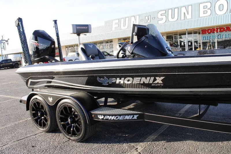 Slide: The Image of 2025 Phoenix 921 ELITE boat on trailer outside dealership. - 31