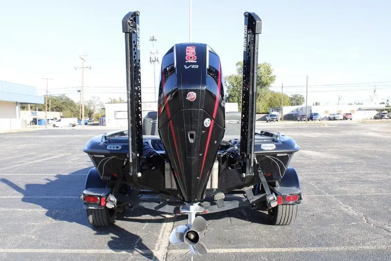 Slide: The Image of 2025 Phoenix 921 ELITE boat with powerful V8 engine, rear view in parking lot. - 33