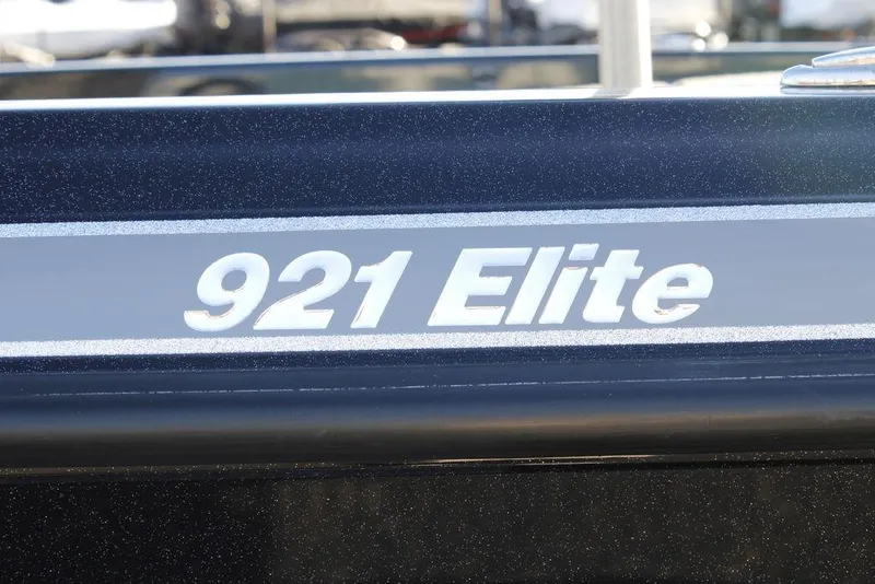 Slide: The Image of Close-up of 2025 Phoenix 921 Elite boat model name on hull. - 5