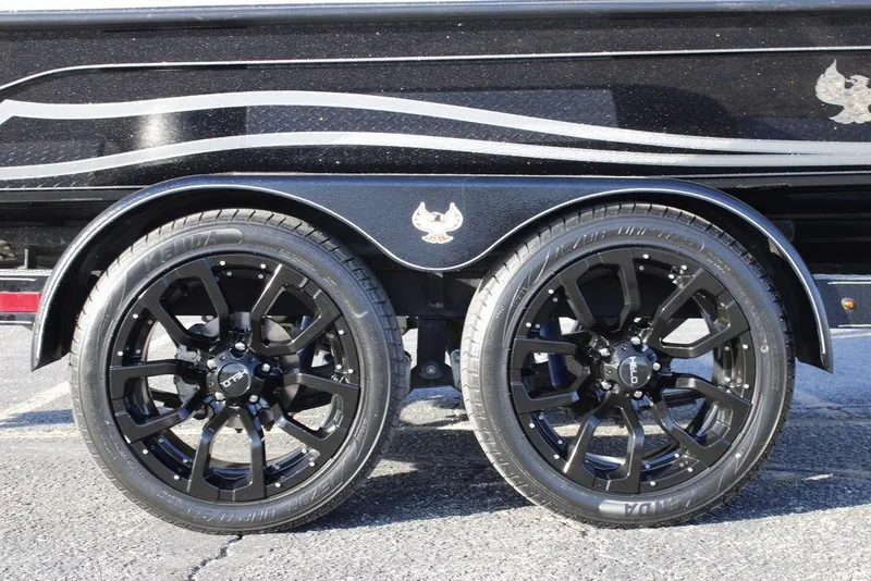 Slide: The Image of 2025 Phoenix 921 ELITE trailer with sleek black alloy wheels and stylish design. - 8