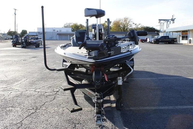 Slide: The Image of 2025 Phoenix 921 ELITE boat on trailer in parking lot, front view. - 9
