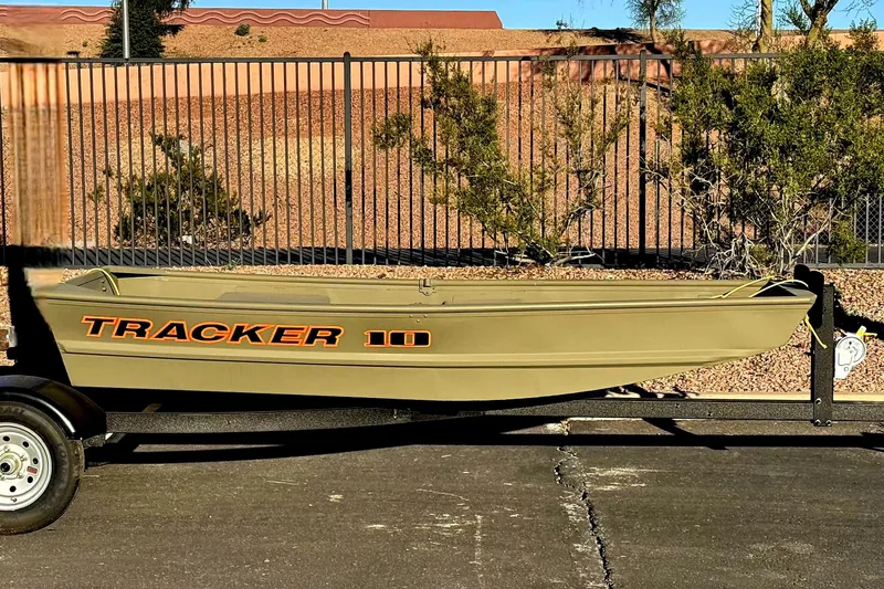 The Image of 2026 Tracker Grizzly 10 Jon boat on trailer, parked outdoors. - 0