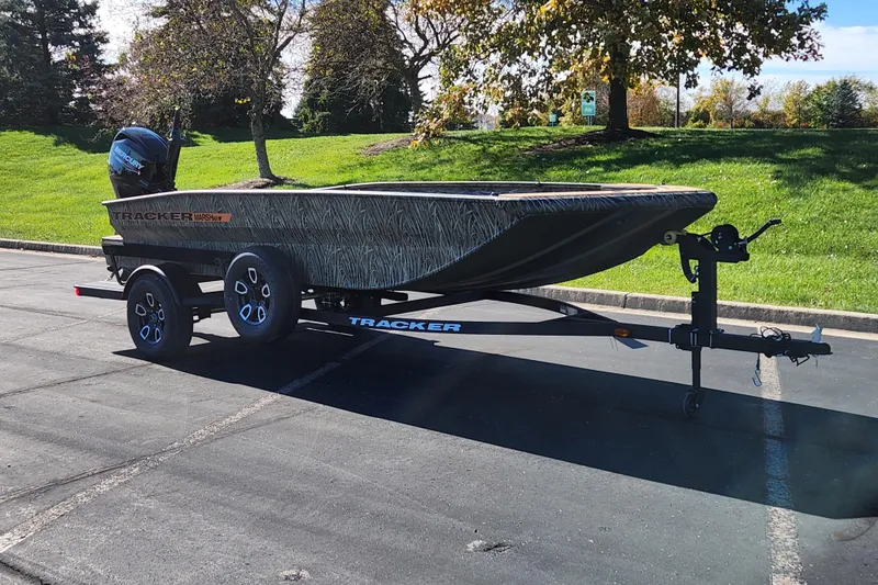 The Image of 2026 Tracker Grizzly 1756 T Marsh boat on trailer in parking lot. - 0
