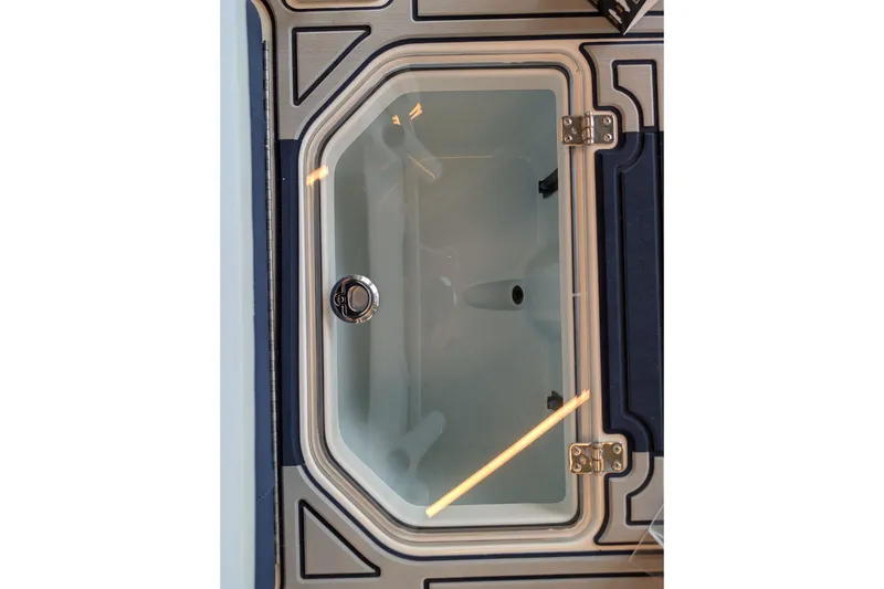Slide: The Image of Livewell compartment of 2026 Mako 18 Pro Skiff Patriot Edition boat. - 11