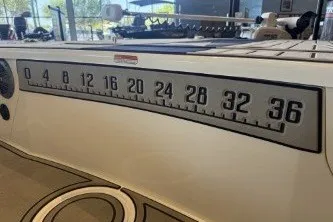 Slide: The Image of 2026 Mako 18 Pro Skiff Patriot Edition with a built-in fish ruler on the deck. - 7