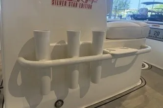 Slide: The Image of 2026 Mako 18 Pro Skiff Patriot Edition boat interior with cup holders and seating. - 8