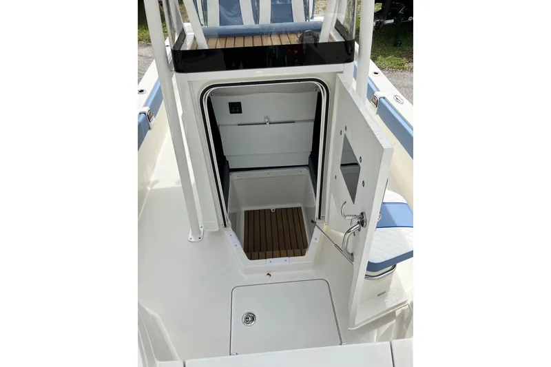 Slide: The Image of 2026 Ranger 2510 Bay boat interior with open cabin door, showcasing sleek design. - 10