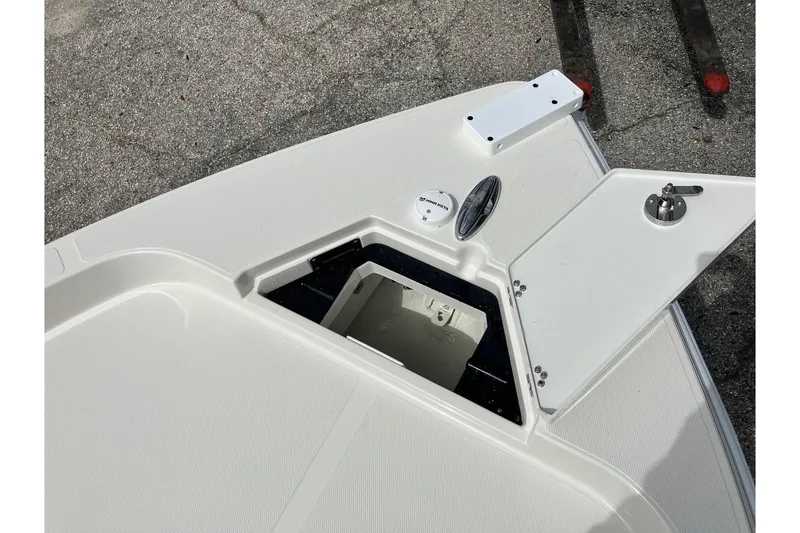 Slide: The Image of Open storage compartment on 2026 Ranger 2510 Bay boat deck. - 11