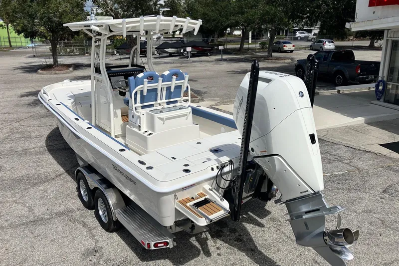 Slide: The Image of 2026 Ranger 2510 Bay boat on trailer, featuring powerful outboard motor. - 4