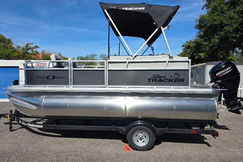 The Image of 2026 Sun Tracker Bass Buggy 16 XL Select pontoon boat with Mercury outboard motor. - 0