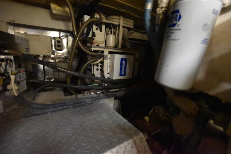 Slide: The Image of Engine room of 1993 Ocean Yachts 44 Aft Cabin with mechanical components and wiring. - 34