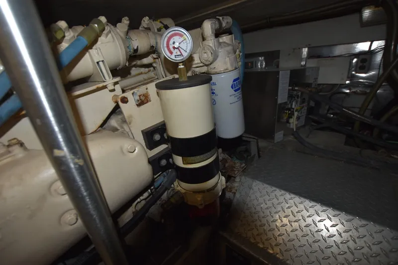 Slide: The Image of Engine room of 1993 Ocean Yachts 44 Aft Cabin with mechanical components and gauge. - 36