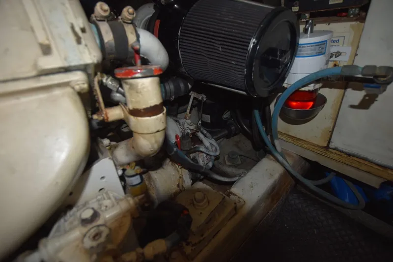 Slide: The Image of Engine room of 1993 Ocean Yachts 44 Aft Cabin, showing mechanical components and filters. - 37