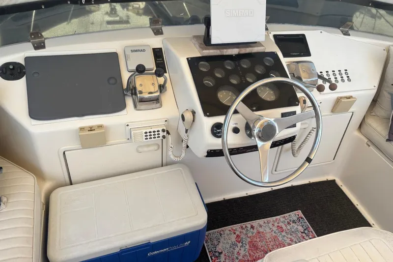 Slide: The Image of 1993 Ocean Yachts 44 Aft Cabin helm with steering wheel and navigation equipment. - 5