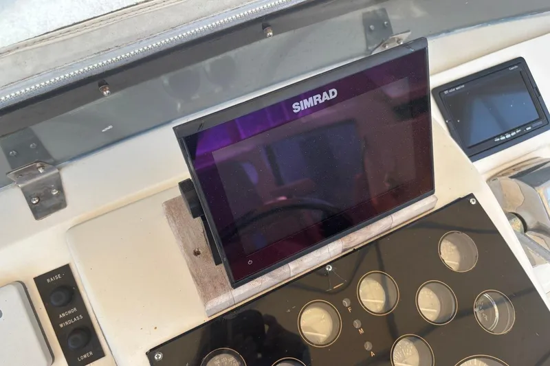 Slide: The Image of Simrad navigation system on 1993 Ocean Yachts 44 Aft Cabin dashboard. - 6