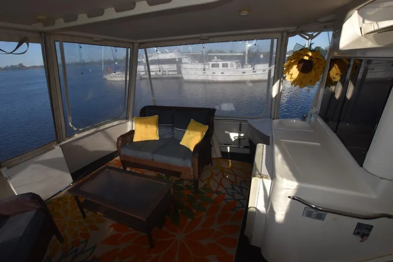 Slide: The Image of 1993 Ocean Yachts 44 Aft Cabin interior with cozy seating and waterfront view. - 15