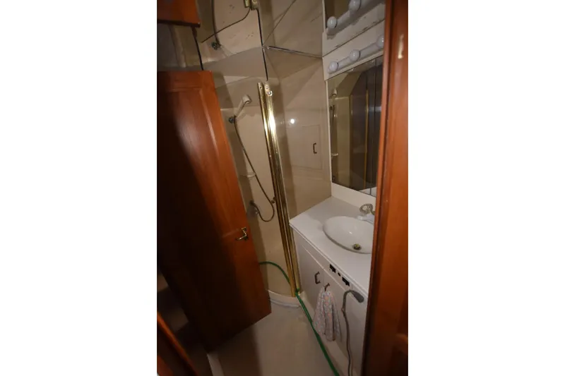 Slide: The Image of Bathroom interior of 1993 Ocean Yachts 44 Aft Cabin with shower and sink. - 16