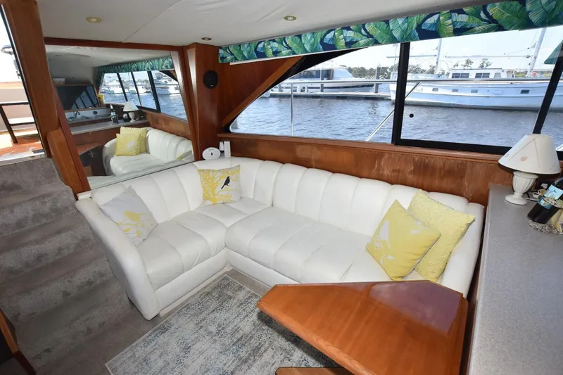 Slide: The Image of Luxurious 1993 Ocean Yachts 44 Aft Cabin interior with white leather seating and nautical decor. - 21
