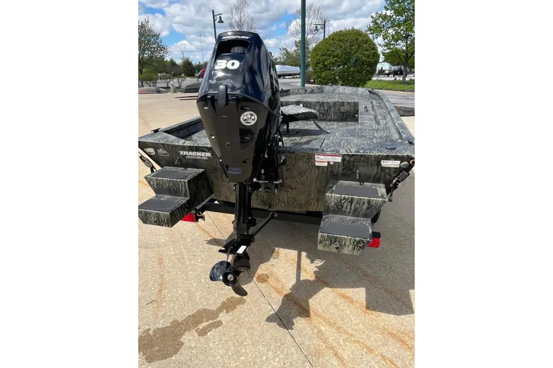 Slide: The Image of 2026 Tracker Grizzly 1654 T Sportsman boat with Mercury 30 outboard motor. - 8