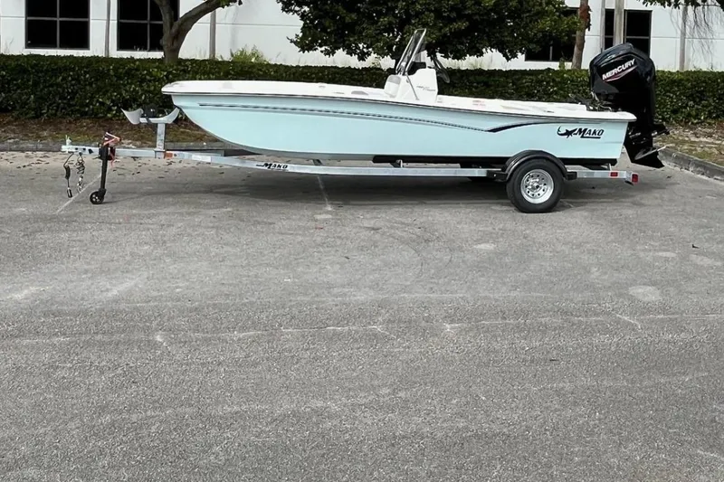 The Image of 2026 Mako Pro Skiff 17 CC boat on trailer, parked outdoors. - 0