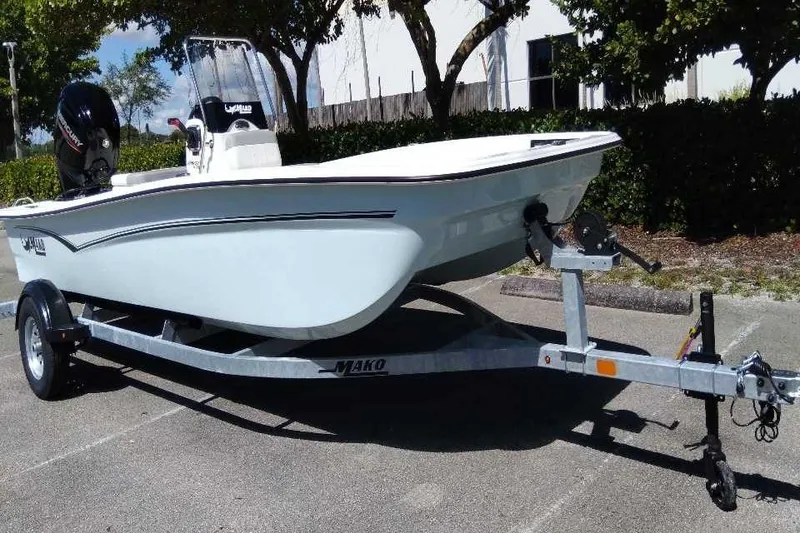 Slide: The Image of 2026 Mako Pro Skiff 17 CC boat on trailer, parked outdoors. - 5