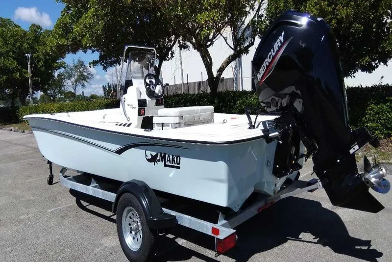 Slide: The Image of 2026 Mako Pro Skiff 17 CC boat on trailer with Mercury outboard motor. - 8