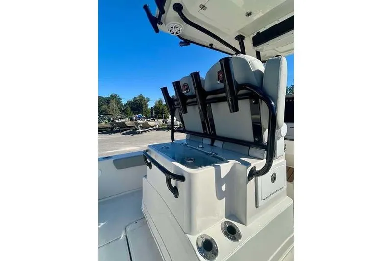 Slide: The Image of 2026 Ranger 2360 Bay boat interior with seating and rod holders. - 10