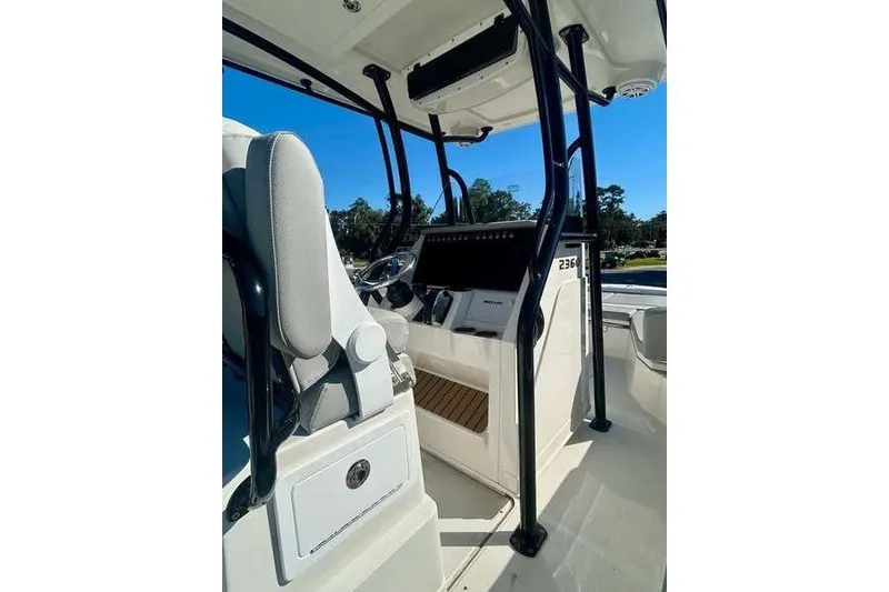 Slide: The Image of 2026 Ranger 2360 Bay boat interior with modern helm and seating. - 12