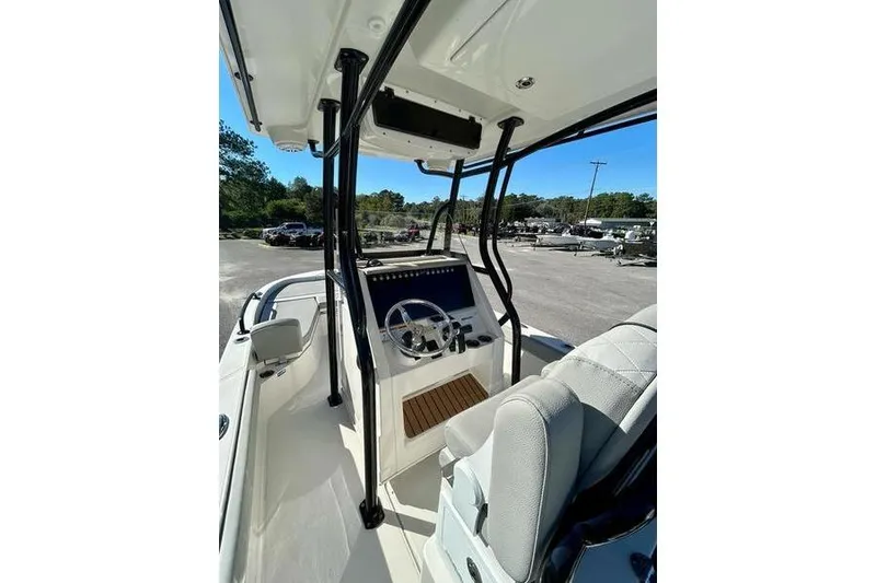 Slide: The Image of 2026 Ranger 2360 Bay boat interior with steering console and seating. - 9