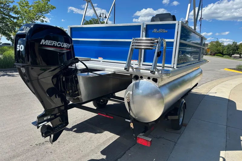 Slide: The Image of 2026 Sun Tracker Party Barge 16 DLX with Mercury 50 engine on a trailer. - 4